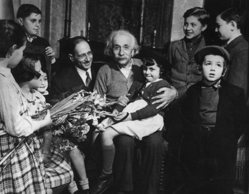 Mar. 03, 1949 - Displaced children pay per-birthday call on Albert Einstein: Youngsters from the reception shelter of united service for new American visited Dr. Albert Einstein, eminent scientist, last week at his home in princeston, new jersey. Dr. Einstein celebrated his seventieth birthday on march 14th, and as a birthdat gift a pledge was given to him by william Rossenwald that all displaced persons in European camps would be out by the end of 1949. Dr. Einstein holds 8-year-old victoria lustig on his lap. On the extreme left is an 11-year old relative, Elozabeth Kersok, who he had never seen before. William Rosewald, national chairman of the united Jewish Appeal, accompanied the group. (Credit Image: © Keystone Pictures USA/ZUMAPRESS.com)