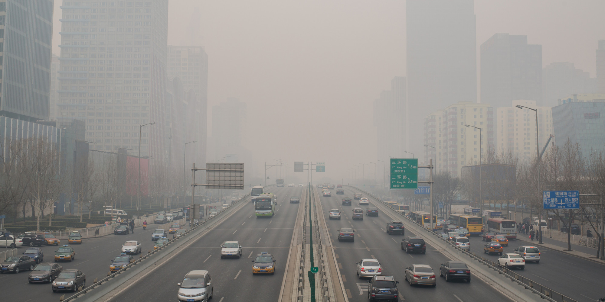 BEIJING, CHINA - 2015/01/15: Cars are driving on the overpass of Beijing CBD in the heavy haze. This is the first Yellow warning of Beijing's air pollution in 2015 and the hazy weather will last a few days. (Photo by Zhang Peng/LightRocket via Getty Images)