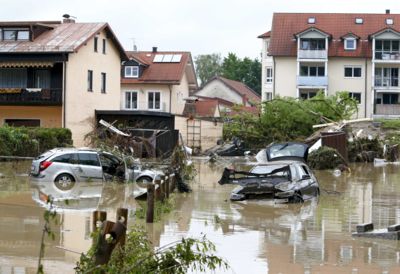 Destroyed cars stand submerged in water following floods in the Bavarian village of Simbach am Inn east of Munich, Germany, June 2, 2016. REUTERS/Michaela Rehle
